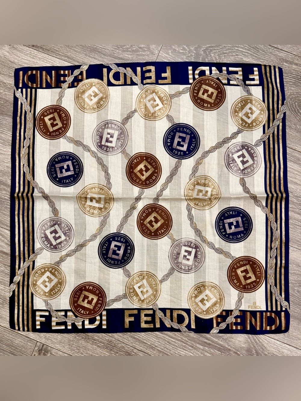 Fendi scarf 23 x 22.5” spend $400 get a free designer scarf valves at $400.